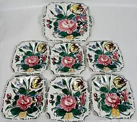 Six hand-painted Majolica ceramics arranged, five plates and one platter, floral pattern