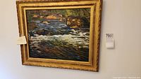 Overall view of framed river painting on wall