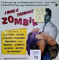 Front cover of the sealed soundtrack LP featuring the title, image of man and woman, and band names.