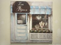 Full view of the vinyl print showing the cafe storefront with window display and sign.