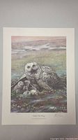 Photo of the full print showing owl with chicks and eggs, surrounded by natural scenery.