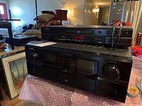 Denon AVR-3806 receiver with Denon DVD-1920 DVD player stacked on top; receiver has a large display panel and multiple front controls.