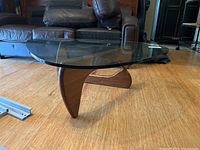 Full view of glass top and wood base in room setting