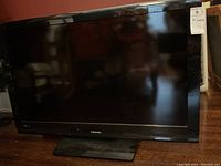Front view of the 40-inch Toshiba television showing the screen and base stand, with Toshiba logo visible on the bezel.