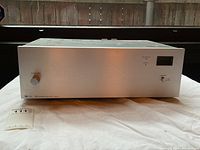 Front view of the TOA 924 amplifier showing power switch, input volume knob, and display meter.