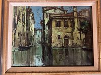 Frontal view of the Venice scene painting showing the entire artwork with gold frame and linen matting on a dark background.