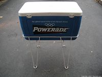 Blue cooler with Power-Ade logo on stand shown from front