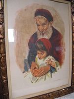 Framed lithograph depicting an elderly man with a white beard and a young boy, measuring 27x36 inches.