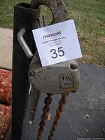 Yale 1 1/2 Ton chain hoist showing side with Yale label and capacity sticker.