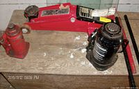 Photo showing all three jacks on a wooden surface, displaying size and color differences.