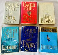 Front covers of six hardcover Danielle Steel novels in a single row: Star, Zoya, Mixed Blessings, Kaleidoscope, Daddy, and Bittersweet. Dust jackets show minor signs of wear.