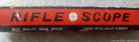 Packaging box top side with text reading 'Rifle Scope, Best Quality Image Moving, Coated Optics, Sealed Elements' in red and black colors.