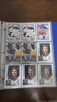 Page showing nine cards of Wayne Gretzky in Edmonton Oilers and some team photos, with duplicates of specific cards