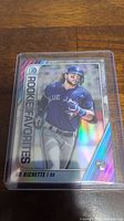 Front view of Bo Bichette Rookie card in protective sleeve, showing player in action with holographic design.