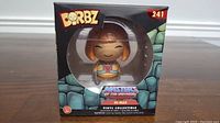 Front view of He-Man Funko Dorbz figure in original box, showing figure and branding