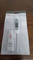 Full view of new Master Chef digital instant-read thermometer in original packaging showing probe and protective sheath.