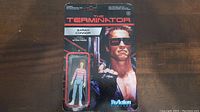 Front of sealed The Terminator ReAction Sarah Connor figure package, showing figurine and card art.