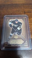 Front view of Sidney Crosby rookie hockey card showing player in Penguins uniform and card design.