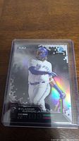 Front view of Vladimir Guerrero Jr Bowman Chrome Bowman’s Best Rookie Card with holographic finish and image of player swinging.