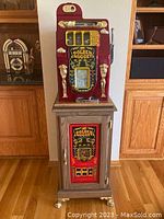 Front view of slot machine mounted on stand