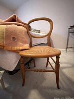 Bentwood chair with curved backrest and original cane seat visible from front angle