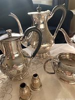 Main group view of coffee pot, teapot, creamer, sugar bowl and salt & pepper shakers