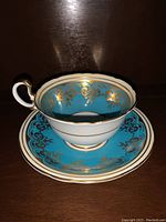 Blue and gold Aynsley 882 teacup and saucer