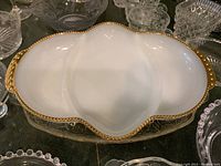 Close-up image of the white Fire King divided serving dish with gold trim, showing detailed edge design and three section compartments.