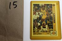 Close-up of the front side of the Magic Johnson basketball card with the player in Lakers uniform.