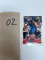 Front view of Quentin Richardson 2001 Upper Deck MVP basketball card showing him in a blue DePaul uniform during a game.