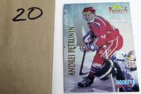 Front view of hockey card showing Andrej Petrovic in red uniform on ice.
