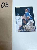 Front side of the 1997 Fleer baseball card showing Charlie O'Brien in Toronto Blue Jays uniform with gold foil text.