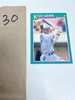 1991 Score Kelly Gruber baseball card with him in batting pose looking left, in Blue Jays grey uniform