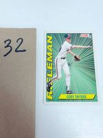 Front full-view of 1991 Score baseball card featuring Cory Snyder with 'ROOKIE' text and green radial burst background.