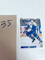 Hockey card showing Alexander Godynyuk in action for the Toronto Maple Leafs with Upper Deck branding and 75th anniversary logo.