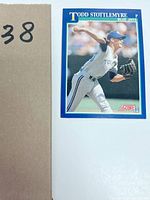 Front image of the baseball card featuring Todd Stottlemyre in Blue Jays pitching uniform with Score 91 logo