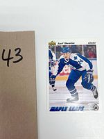 Hockey card of Scott Thornton in Maple Leafs uniform, number 24, from 1991 Upper Deck series, showing him skating in game action, with visible logos and clear card details.