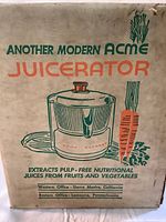 Box of Acme Juicerator showing vintage branding and claims of pulp-free juice extraction