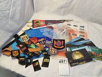 Collection showing postcards, patches, brochures, badges and other small items related to Expo 67 event
