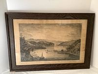 Photo showing full framed print depicting Gaspe Bay with boats and hills.