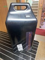Full view of black car generator unit with handle and label reading 'Car Generator.'