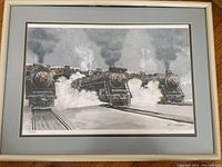 Framed print showing three steam locomotives in steam with smoke, front view, with matting and frame.