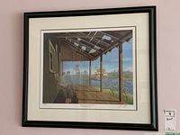 Framed limited edition print showing the full artwork with a porch scene, four men, water, lighthouse, and natural background.