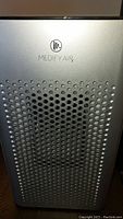 Close-up of front panel with Medify air purifier branding and ventilation holes