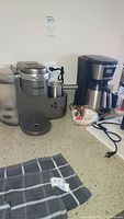 Wide view showing both the Keurig and Black & Decker coffee makers on the counter.