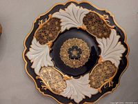 Top view of vintage Weimar platter showing scalloped edges, dark blue and white sections with gold floral detailing.