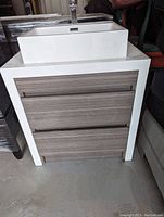 Front view of vanity with vessel sink and two drawers