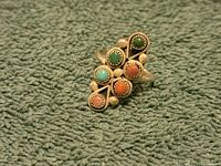 Front view of the Southwest style sterling ring showing six colored cabochon stones (green, turquoise, coral).