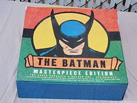 Box cover with colorful illustration of Batman and "The Batman Masterpiece Edition" text