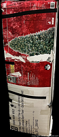 Photo of the original box showing tree image and box condition with security straps